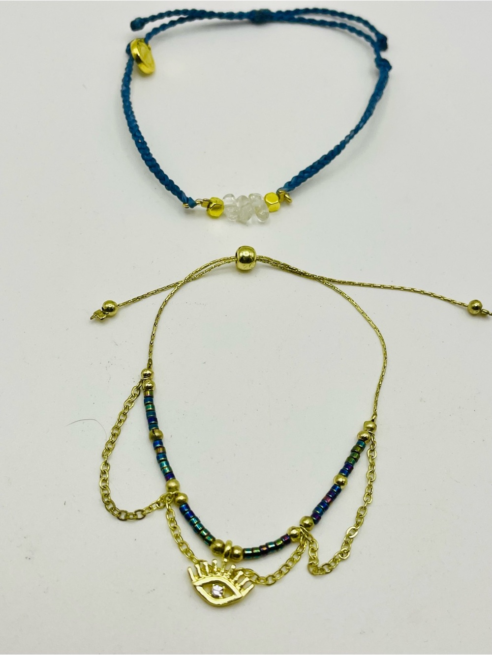 Gold Tone Evil Eye Drawstring & Pure Vida Blue Cord Clear Crystas Bracelet Set